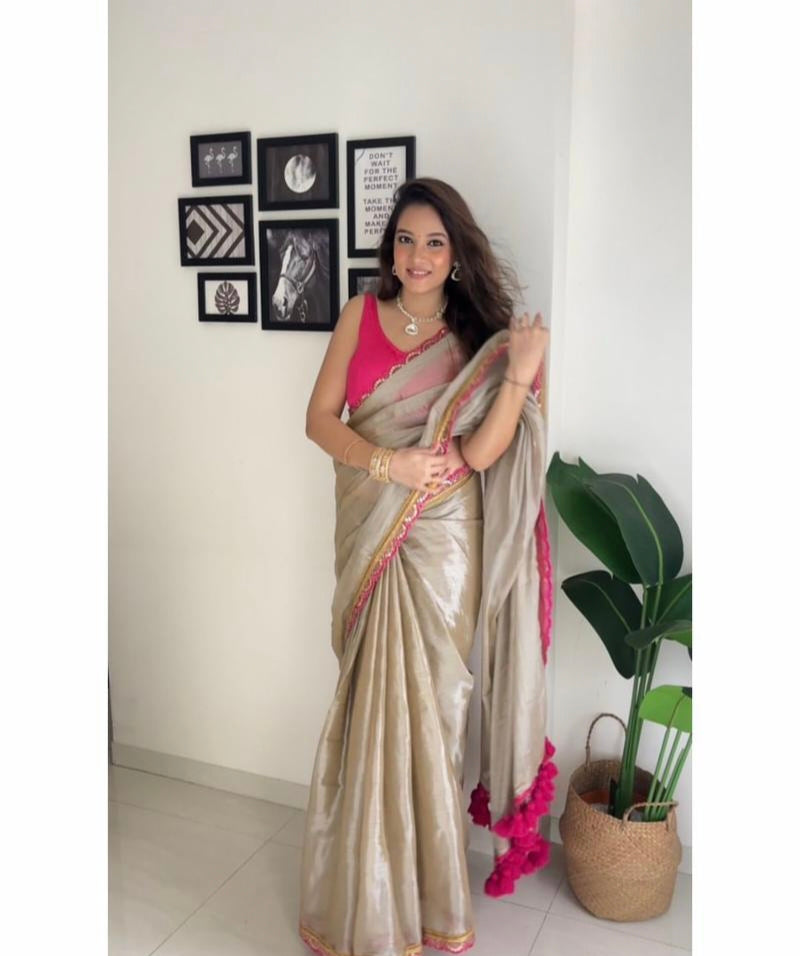 Presenting you trending gold tissue Saree with fancy lace border 25 lotkan