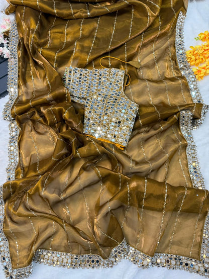 New mirror work saree features Soft  jimmy choo Organza saree which is embedded with real mirror work Embroidery all over the borders