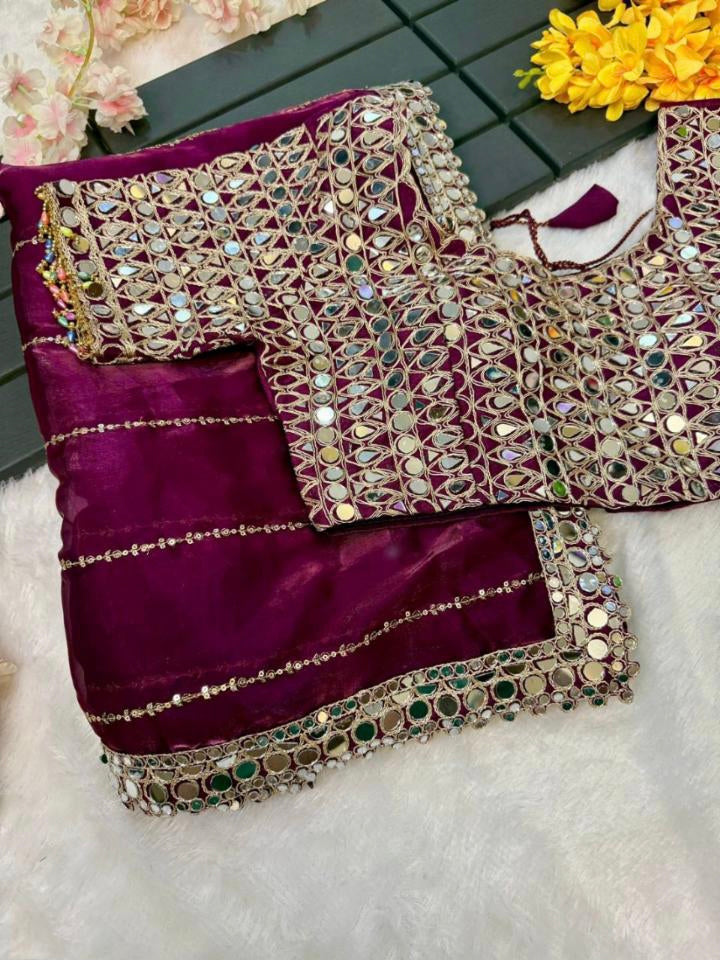 New mirror work saree features Soft  jimmy choo Organza saree which is embedded with real mirror work Embroidery all over the borders