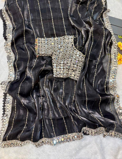 New mirror work saree features Soft  jimmy choo Organza saree which is embedded with real mirror work Embroidery all over the borders