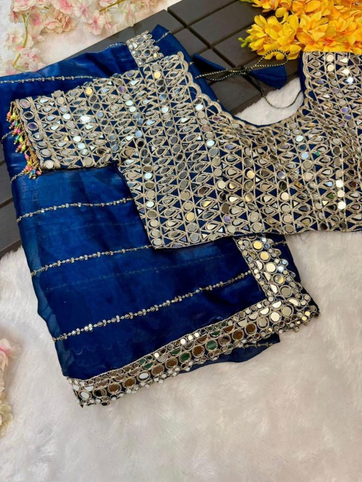 New mirror work saree features Soft  jimmy choo Organza saree which is embedded with real mirror work Embroidery all over the borders