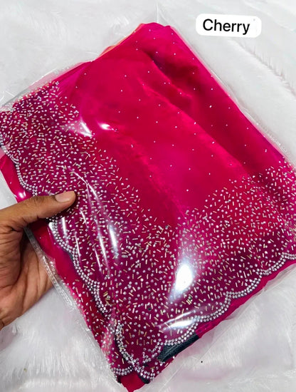 Premium Fandy Satin saree pure hand diamond work.